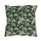 Sage and cream hydrangeas on dark forest green outdoor pillow