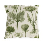Green outdoor pillow with engraved botanical fennel, Queen Anne's lace and wild herbs in olive on cream