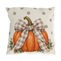 Orange pumpkin with a taupe gingham bow and eucalyptus on a cream polka dot outdoor pillow