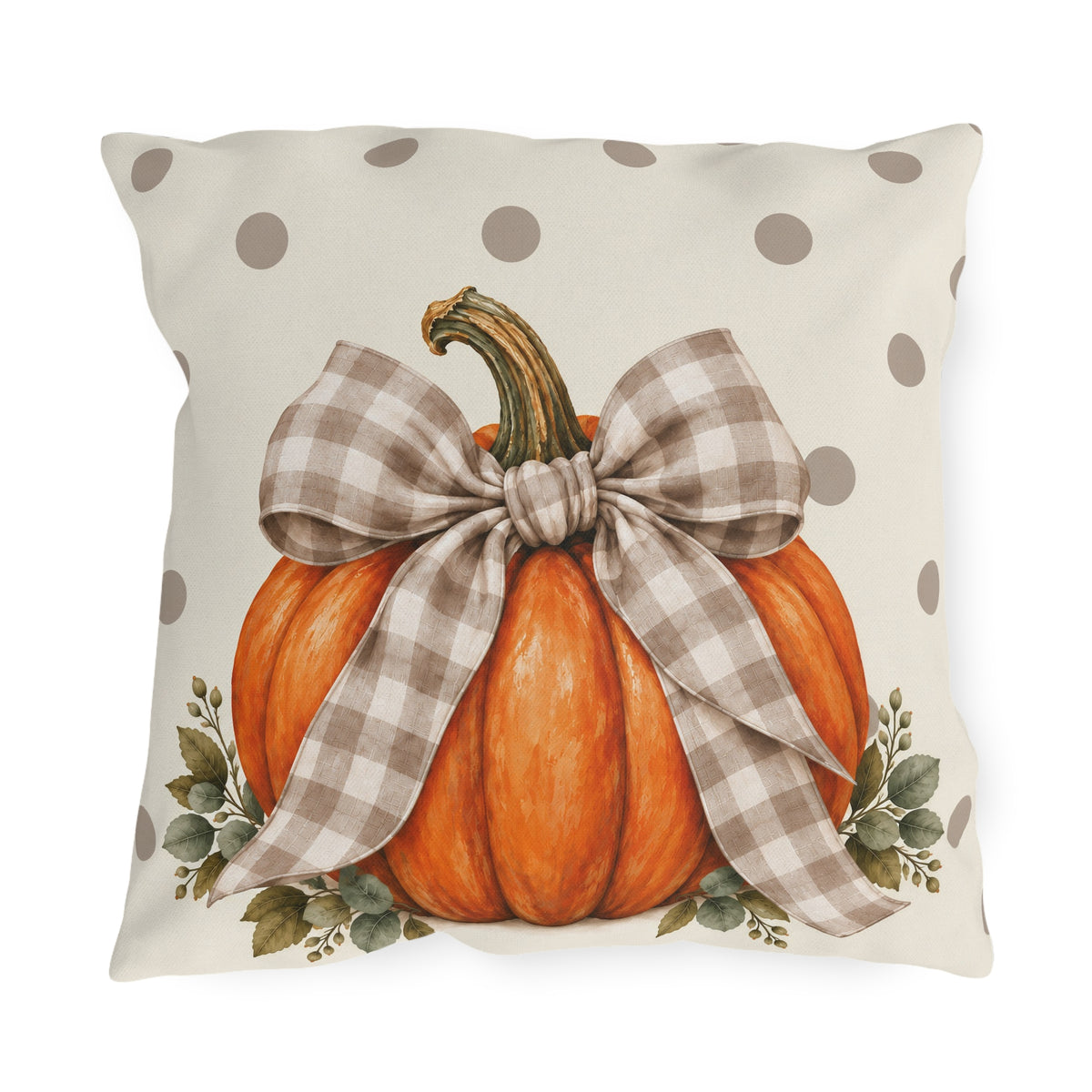 Orange pumpkin with a taupe gingham bow and eucalyptus on a cream polka dot outdoor pillow