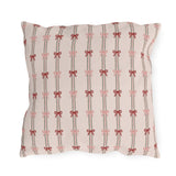 Pink and red ribbon bows on striped blush outdoor pillow
