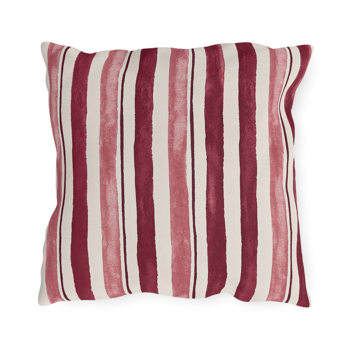 Cranberry and rose painted stripes on a cream outdoor pillow
