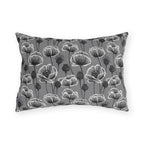 White and charcoal poppies and seed heads on grey outdoor lumbar pillow