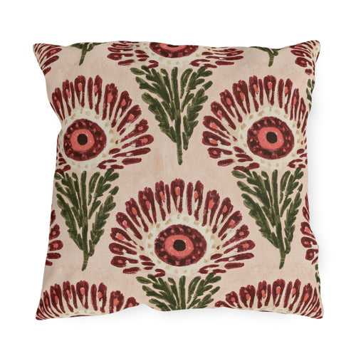 Block print floral outdoor pillow with wine red fan flowers, coral centers and olive leaves on blush