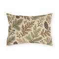 Cedar, spruce and pinecones in sage and brown on a cream outdoor lumbar pillow