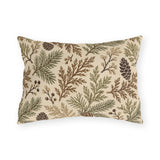Cedar, spruce and pinecones in sage and brown on a cream outdoor lumbar pillow