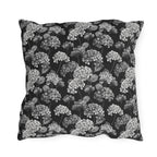 White and grey hydrangeas on black outdoor pillow