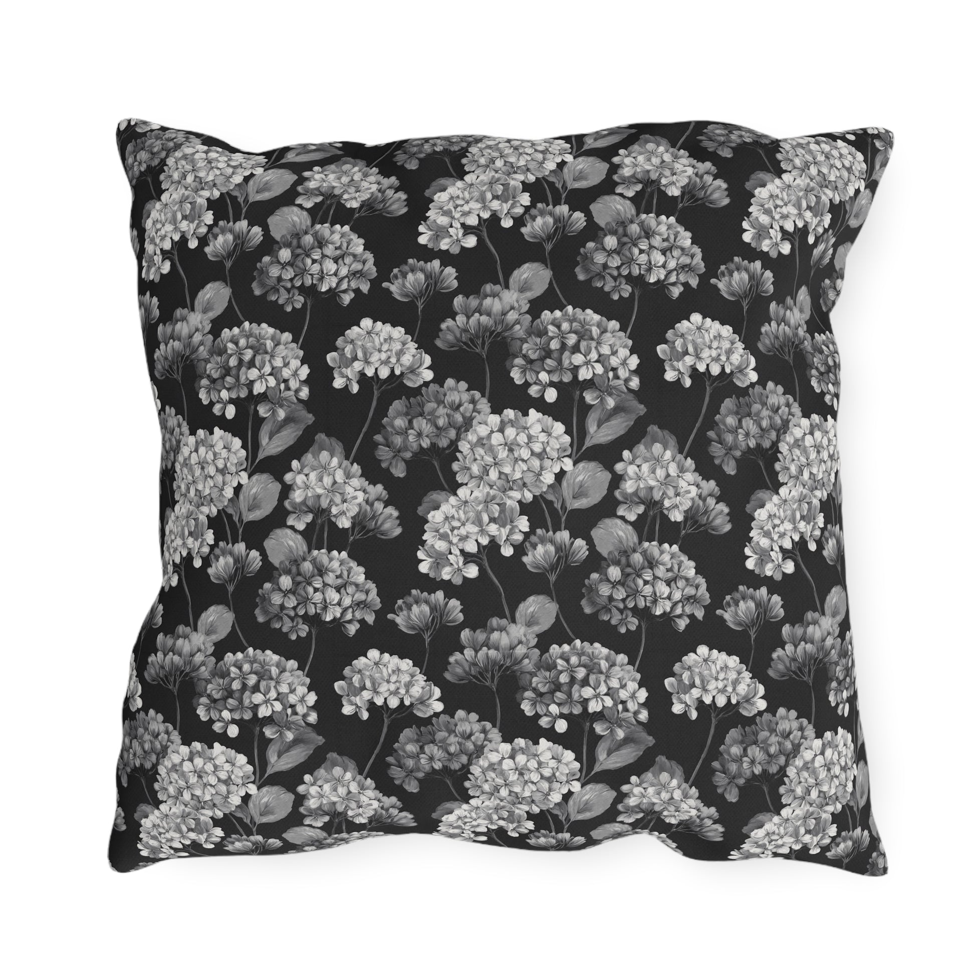 White and grey hydrangeas on black outdoor pillow