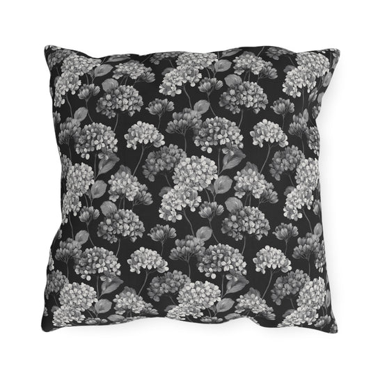 White and grey hydrangeas on black outdoor pillow