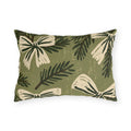 Cream bows and dark spruce sprigs on a soft sage green outdoor lumbar pillow