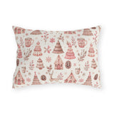 Pink patterned Christmas trees, deer, gingerbread houses and cocoa mugs on cream outdoor lumbar pillow
