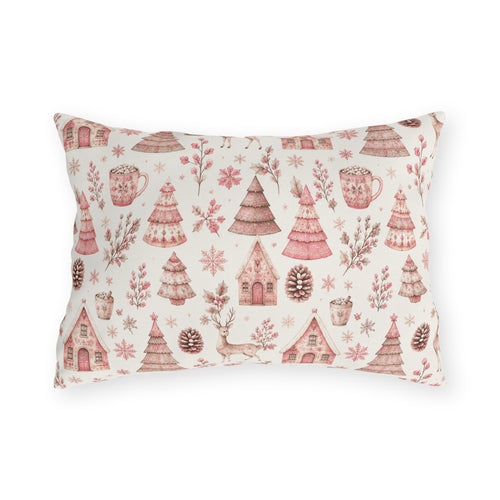 Pink patterned Christmas trees, deer, gingerbread houses and cocoa mugs on cream outdoor lumbar pillow