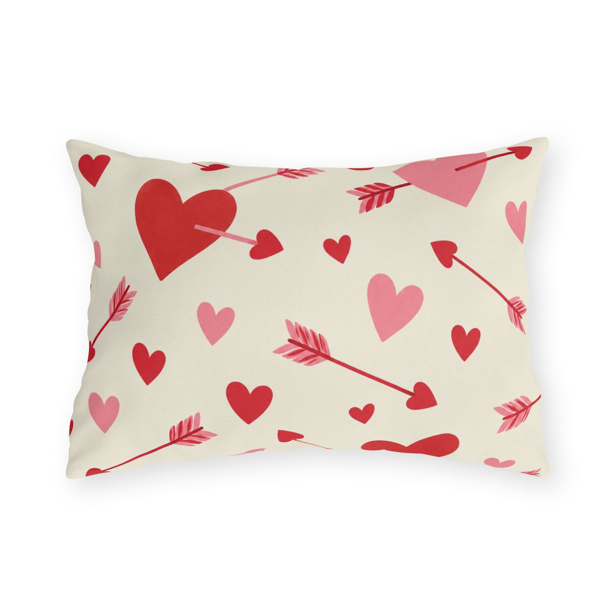Valentine's outdoor lumbar pillow with red and pink cupid arrows and hearts on cream