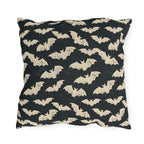 Bone white bats on a charcoal outdoor pillow, worn block print Halloween pattern