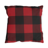 Buffalo check outdoor pillow with a large printed check in cranberry red, black and burgundy