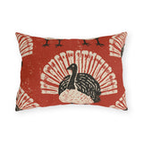 Black and cream block print turkeys on a brick red outdoor lumbar pillow