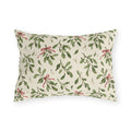 Christmas mistletoe outdoor lumbar pillow with sage green sprigs, white berries and thin red bows on warm cream