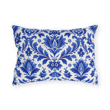 Cobalt blue delft damask pattern on a white outdoor lumbar pillow