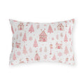 Pink gingerbread houses, trees and lampposts on white outdoor lumbar pillow