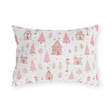 Pink gingerbread houses, trees and lampposts on white outdoor lumbar pillow