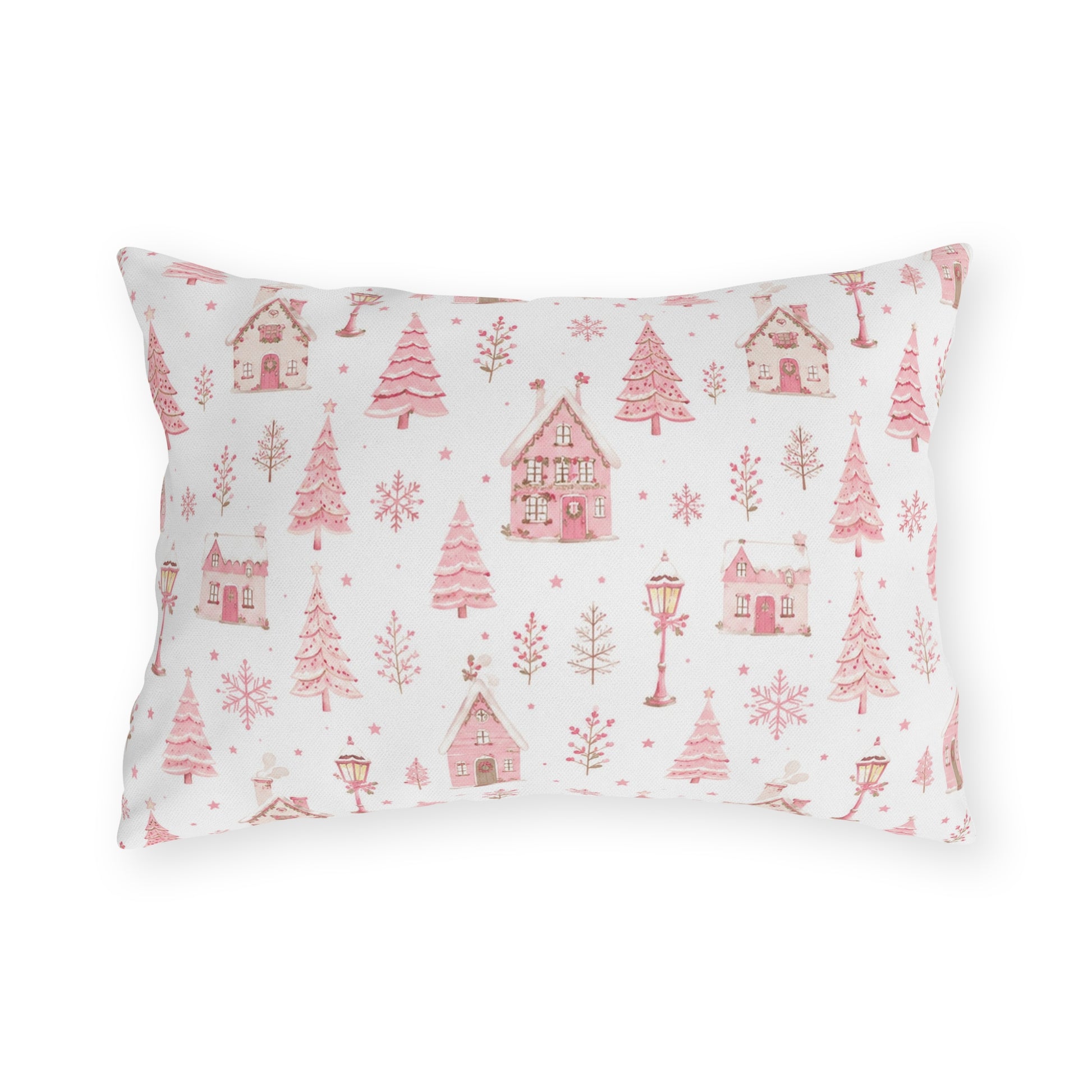 Pink gingerbread houses, trees and lampposts on white outdoor lumbar pillow
