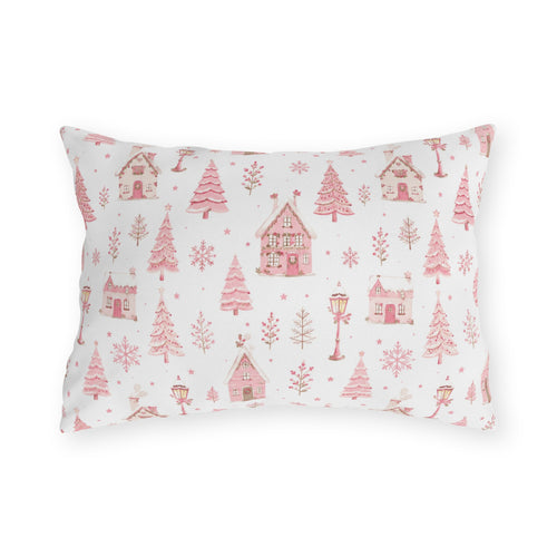 Pink gingerbread houses, trees and lampposts on white outdoor lumbar pillow