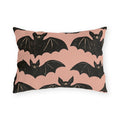 Black block print bats on a dusty blush outdoor lumbar pillow