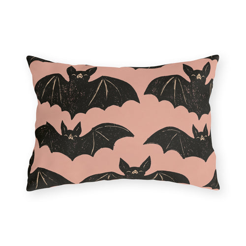 Black block print bats on a dusty blush outdoor lumbar pillow