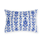 Cobalt blue folk tulip stripes on a white outdoor lumbar pillow