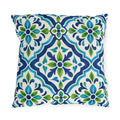 Blue and green Moroccan tile pattern on a white outdoor pillow