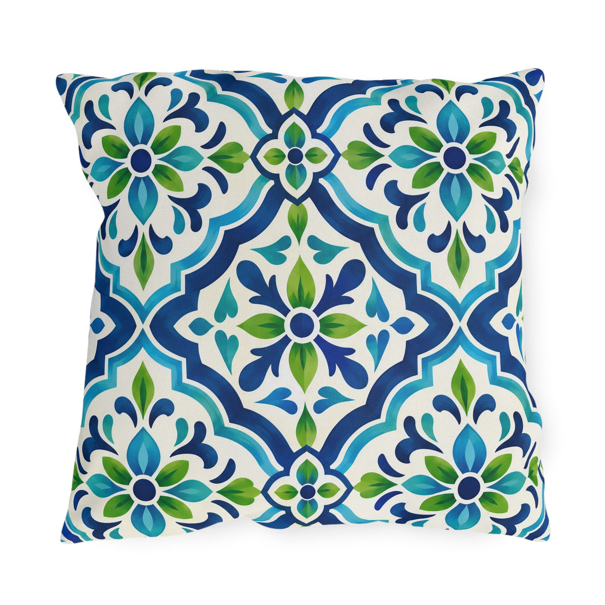 Blue and green Moroccan tile pattern on a white outdoor pillow