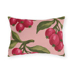 Pink outdoor lumbar pillow with painted raspberry red berry clusters and olive green leaves on blush