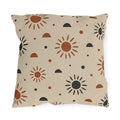 Boho outdoor pillow with rust and charcoal hand-drawn suns and half circles on light sand
