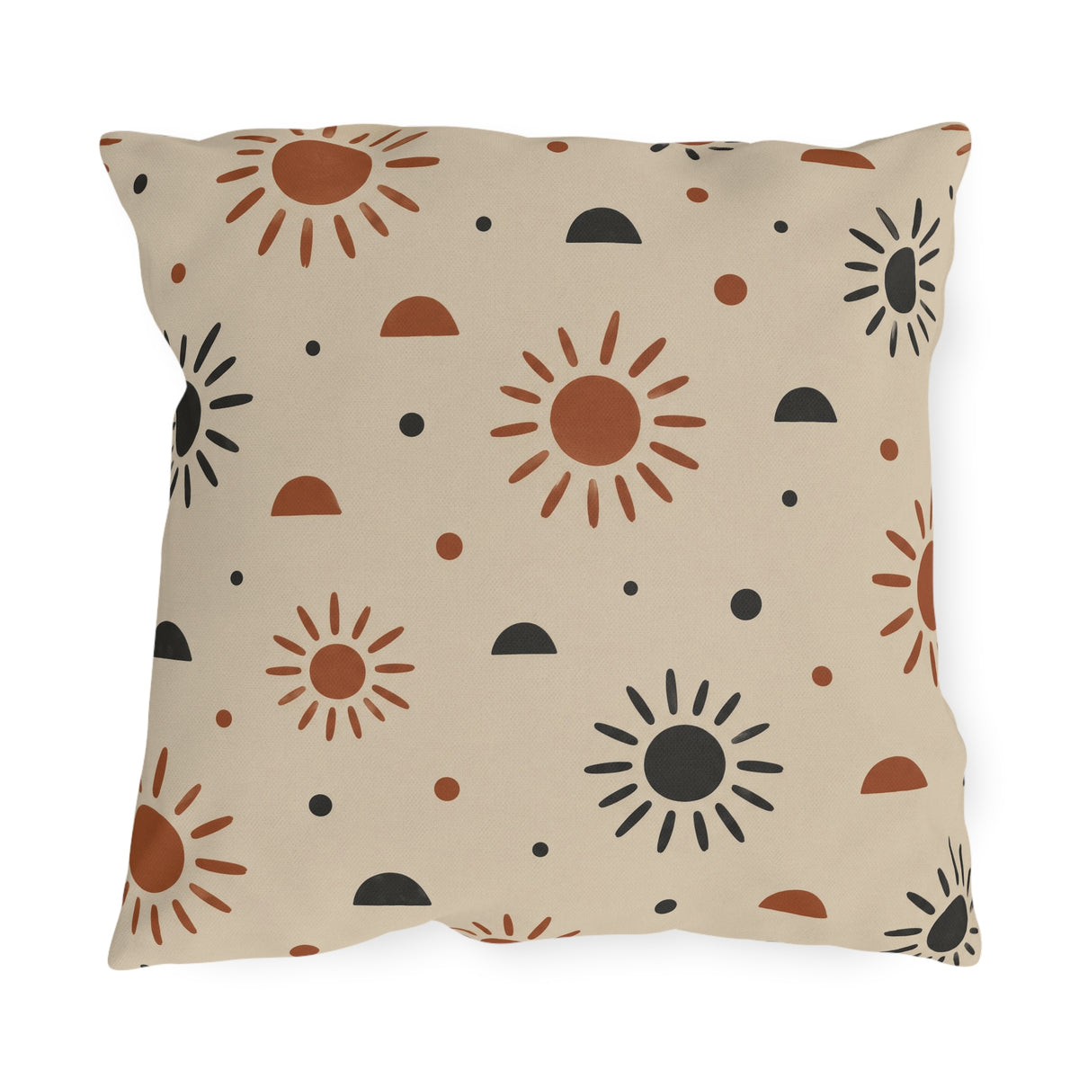 Boho outdoor pillow with rust and charcoal hand-drawn suns and half circles on light sand
