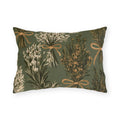 Rosemary, lavender and thyme bundles tied with twine on a sage green outdoor lumbar pillow
