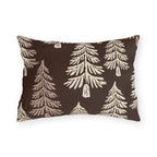Cream fir trees on a dark chocolate outdoor lumbar pillow