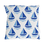 Coastal outdoor pillow with rows of cobalt and sky blue sailboats and waves on white
