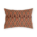 Nested ikat diamonds in charcoal and cream on a burnt rust outdoor lumbar pillow