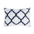 Navy and white quatrefoil outdoor lumbar pillow with a bold Moroccan trellis on crisp white
