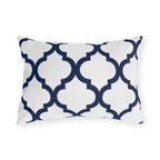 Navy and white quatrefoil outdoor lumbar pillow with a bold Moroccan trellis on crisp white