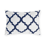 Navy and white quatrefoil outdoor lumbar pillow with a bold Moroccan trellis on crisp white