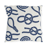 Nautical outdoor pillow with navy sailor rope knots, loops and coils on warm white