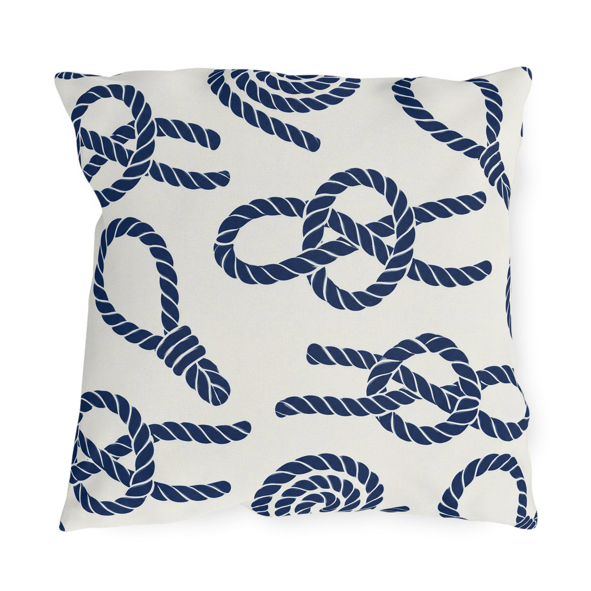Nautical outdoor pillow with navy sailor rope knots, loops and coils on warm white