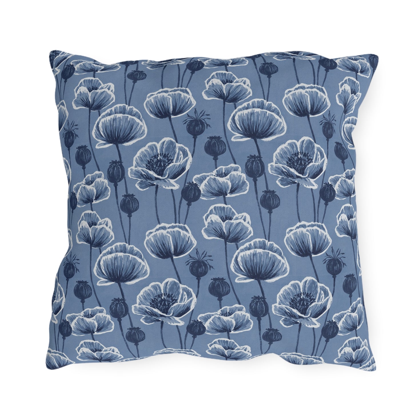 Navy and white poppies and seed heads on blue outdoor pillow