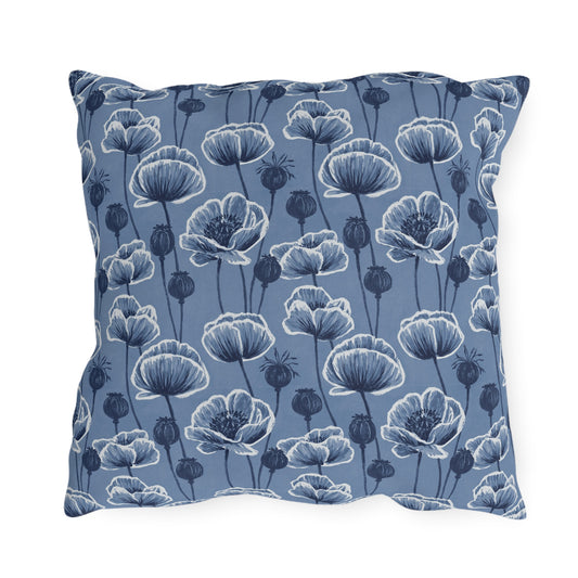 Navy and white poppies and seed heads on blue outdoor pillow