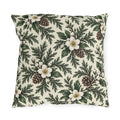 White winter roses, cedar, pinecones and white berries on a cream outdoor pillow