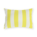 Bright yellow and cream cabana stripes on an outdoor lumbar pillow