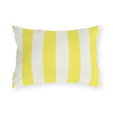 Bright yellow and cream cabana stripes on an outdoor lumbar pillow