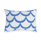 Blue outdoor lumbar pillow with hand-painted cornflower blue scallops in overlapping rows on white