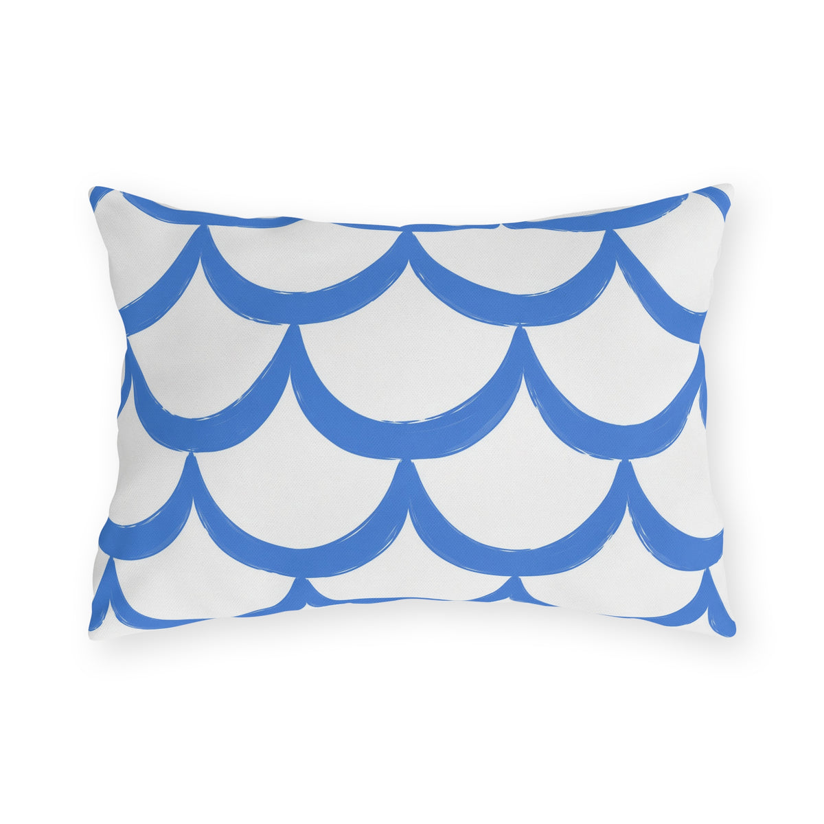 Blue outdoor lumbar pillow with hand-painted cornflower blue scallops in overlapping rows on white